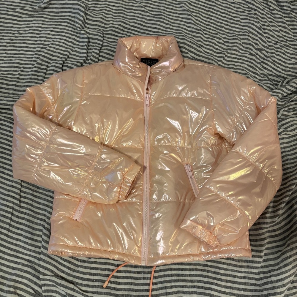 Club Exx Dolls Kill pink holographic puffer jacket for rave festival party